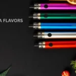 Muha flavors collection showing colorful Muha Meds disposable vape pens surrounded by fresh tropical fruits on dark background